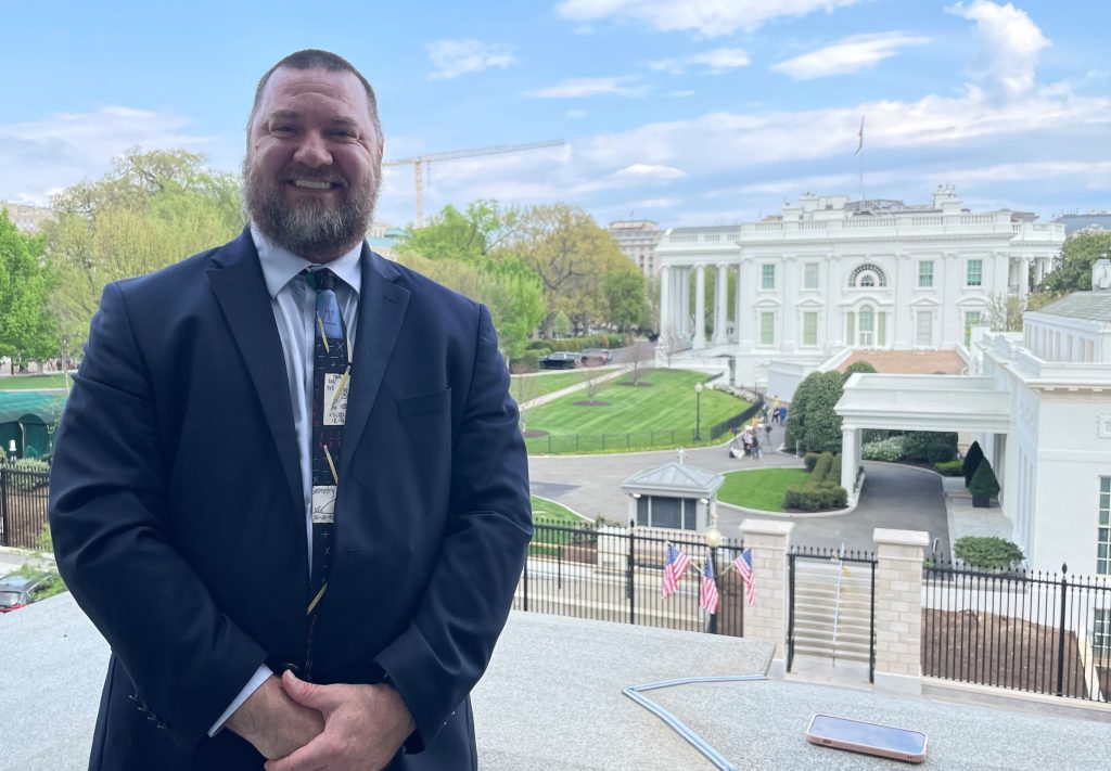 NCSM President Paul Gray poses in front of the West Wing of the White House